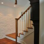 New stair with old stone wall from original exterior