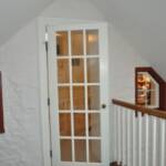 Entry to new attic office with old exterior windows