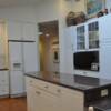  The Kitchen  was expanded vertically with a vaulted ceiling and a skylight.