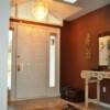 A more gracious entry was achieved by the addition of transom windows and a skylight.