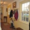 A Mud room with a handmade brick tile floor replaced  the former servant's apartment.  