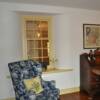 This window discovered during the renovation now reveals the foyer beyond.