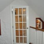 Entry to new attic office with old exterior windows